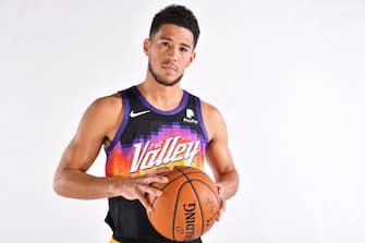 PHOENIX, AZ - DECEMBER 8: Devin Booker #1 of the Phoenix Suns poses for a portrait during content day at the Verizon 5G Performance Center on December 8, 2020 in Phoenix, Arizona. NOTE TO USER: User expressly acknowledges and agrees that, by downloading and or using this Photograph, user is consenting to the terms and conditions of the Getty Images License Agreement. Mandatory Copyright Notice: Copyright 2020 NBAE (Photo by Barry Gossage/NBAE via Getty Images)