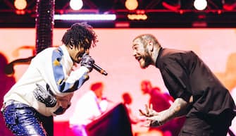 INDIO, CALIFORNIA - APRIL 16: 21 Savage and Post Malone perform at the Sahara Tent at 2022 Coachella Valley Music and Arts Festival weekend 1 - day 2 on April 16, 2022 in Indio, California. (Photo by Matt Winkelmeyer/Getty Images for Coachella)