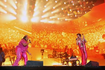 INDIO, CALIFORNIA - APRIL 22: (L-R) Lizzo and Harry Styles perform on the Coachella stage during the 2022 Coachella Valley Music And Arts Festival on April 22, 2022 in Indio, California. (Photo by Kevin Mazur/Getty Images for Harry Styles)