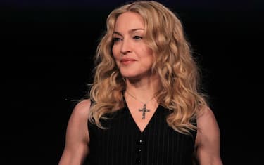 INDIANAPOLIS, IN - FEBRUARY 02:  Singer Madonna looks on during a press conference for the Bridgestone Super Bowl XLVI halftime show at the Super Bowl XLVI Media Center in the J.W. Marriott Indianapolis on February 2, 2012 in Indianapolis, Indiana.  (Photo by Scott Halleran/Getty Images)