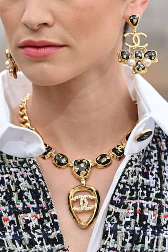 MONTE-CARLO, MONACO - MAY 05: A model (Jewelry detail) walks the runway during the Chanel Cruise 2023 Collection on May 05, 2022 in Monte-Carlo, Monaco.  (Photo by Stephane Cardinale - Corbis / Corbis via Getty Images)