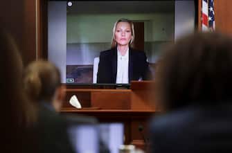 epa09974650 Model Kate Moss, a former girlfriend of actor Johnny Depp, testifies via video link during Depp's defamation trial against his ex-wife Amber Heard, at the Fairfax County Circuit Courthouse in Fairfax, Virginia, USA, 25 May 2022. Johnny Depp's 50 million US dollar defamation lawsuit against Amber Heard started on 10 April.  EPA/EVELYN HOCKSTEIN / POOL
