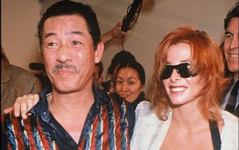 Issey Miyake and Mylene Farmer - Backstage - Issey Miyake ready to wear fashion show spring summer 1994 collection in Paris. (Photo by Bertrand Rindoff Petroff/Getty Images)