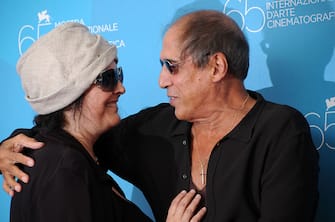 Singer Adriano Celentano and his wife Claudia Mori attend the photo call of "Yuppi Du" during 65th Venice Film Festival. (Photo by camilla morandi/Corbis via Getty Images)
