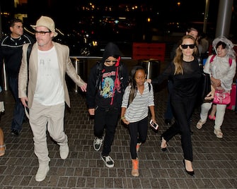 LOS ANGELES, CA - JUNE 06: Brad Pitt, Maddox Jolie-Pitt, Zahara Jolie-Pitt and Angelina Jolie are seen at LAX on June 06, 2014 in Los Angeles, California.  (Photo by GVK/Bauer-Griffin/GC Images)