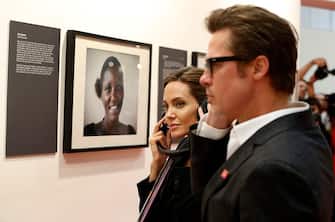 LONDON, ENGLAND - JUNE 12:  Actor Brad Pitt and UN Special Envoy and actress Angelina Jolie listen to testimonies of victims of violence as they attend the Global Summit to End Sexual Violence in Conflict at ExCel on June 12, 2014 in London, England. The four-day conference on sexual violence in war is hosted by Foreign Secretary William Hague and UN Special Envoy and actress Angelina Jolie.  (Photo by Lefteris Pitarakis - Pool/Getty Images)