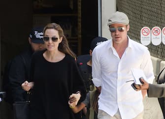 LOS ANGELES, CA - JUNE 14: Angelina Jolie and Brad Pitt are seen at LAX on June 14, 2014 in Los Angeles, California.  (Photo by GONZALO/Bauer-Griffin/GC Images)