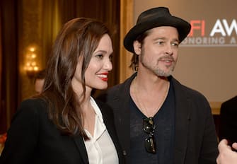 BEVERLY HILLS, CA - JANUARY 09:  Director/actress Angelina Jolie (L) and actor/producer Brad Pitt attends the 15th Annual AFI Awards Luncheon at Four Seasons Hotel Los Angeles at Beverly Hills on January 9, 2015 in Beverly Hills, California.  (Photo by Michael Kovac/Getty Images for AFI)