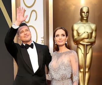 HOLLYWOOD, CA - MARCH 2: Brad Pitt (L) and Angelina Jolie arrive at the 86th Annual Academy Awards at Hollywood & Highland Center on March 2, 2014 in Los Angeles, California. (Photo by Dan MacMedan/WireImage)