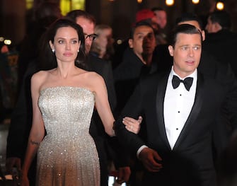 HOLLYWOOD, CA - NOVEMBER 05:  (L-R) Actress Angelina Jolie and actor Brad Pitt arrive at AFI FEST 2015 Presented By Audi Opening Night Gala Premiere Of Universal Pictures' 'By The Sea' at TCL Chinese 6 Theatres on November 5, 2015 in Hollywood, California.  (Photo by Barry King/Getty Images)