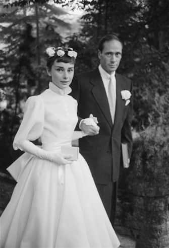 25th September 1954:  Film star couple Audrey Hepburn (1929 - 1993) and Mel Ferrer on their wedding day. Dress designed by Balmain.  (Photo by Ernst Haas/Ernst Haas/Getty Images)