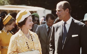 Queen Elizabeth II and Prince Philip in New Zealand during their Commonwealth Tour, 1974. Behind them are Princess Anne and her husband Mark Phillips. (Photo by Fox Photos/Hulton Archive/Getty Images)