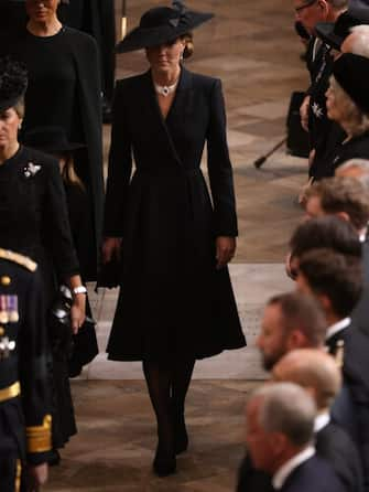 LONDON, ENGLAND - SEPTEMBER 19: Catherine, Princess of Wales enters Westminster Abbey during the State Funeral of Queen Elizabeth II at Westminster Abbey arrive for the State Funeral of Queen Elizabeth II, held at Westminster Abbey, on September 19, 2022 in London, England. Elizabeth Alexandra Mary Windsor was born in Bruton Street, Mayfair, London on 21 April 1926. She married Prince Philip in 1947 and ascended the throne of the United Kingdom and Commonwealth on 6 February 1952 after the death of her Father, King George VI. Queen Elizabeth II died at Balmoral Castle in Scotland on September 8, 2022, and is succeeded by her eldest son, King Charles III. (Photo by Ian Vogler - WPA Pool/Getty Images)