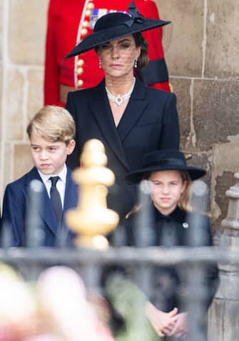 LONDON, ENGLAND - SEPTEMBER 19: George of Wales, Catherine, Princess of Wales, Princess Charlotte of Wales during the State Funeral of Queen Elizabeth II at Westminster Abbey on September 19, 2022 in London, England. Elizabeth Alexandra Mary Windsor was born in Bruton Street, Mayfair, London on 21 April 1926. She married Prince Philip in 1947 and ascended the throne of the United Kingdom and Commonwealth on 6 February 1952 after the death of her Father, King George VI. Queen Elizabeth II died at Balmoral Castle in Scotland on September 8, 2022, and is succeeded by her eldest son, King Charles III. (Photo by Samir Hussein/WireImage)