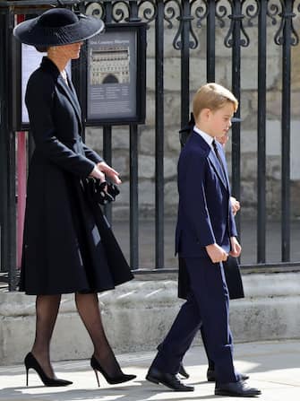 LONDON, ENGLAND - SEPTEMBER 19: Catherine, Princess of Wales, Prince George of Wales leave Westminster Abbey during the State Funeral of Queen Elizabeth II on September 19, 2022 in London, England. Elizabeth Alexandra Mary Windsor was born in Bruton Street, Mayfair, London on 21 April 1926. She married Prince Philip in 1947 and ascended the throne of the United Kingdom and Commonwealth on 6 February 1952 after the death of her Father, King George VI. Queen Elizabeth II died at Balmoral Castle in Scotland on September 8, 2022, and is succeeded by her eldest son, King Charles III.  (Photo by Chris Jackson/Getty Images)