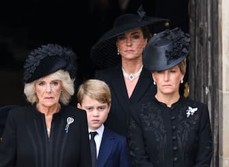 LONDON, ENGLAND - SEPTEMBER 19: (L-R) Camilla, Queen Consort, Prince George of Wales, Catherine, Princess of Wales and Sophie, Countess of Wessex during the State Funeral of Queen Elizabeth II at Westminster Abbey on September 19, 2022 in London, England. Elizabeth Alexandra Mary Windsor was born in Bruton Street, Mayfair, London on 21 April 1926. She married Prince Philip in 1947 and ascended the throne of the United Kingdom and Commonwealth on 6 February 1952 after the death of her Father, King George VI. Queen Elizabeth II died at Balmoral Castle in Scotland on September 8, 2022, and is succeeded by her eldest son, King Charles III. (Photo by Karwai Tang/WireImage)