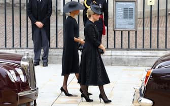 LONDON, ENGLAND - SEPTEMBER 19: Sophie, Countess of Wessex, and Meghan, Duchess of Sussex arrive for the State Funeral of Queen Elizabeth II at Westminster Abbey on September 19, 2022 in London, England.  Elizabeth Alexandra Mary Windsor was born in Bruton Street, Mayfair, London on 21 April 1926. She married Prince Philip in 1947 and ascended the throne of the United Kingdom and Commonwealth on 6 February 1952 after the death of her Father, King George VI. Queen Elizabeth II died at Balmoral Castle in Scotland on September 8, 2022, and is succeeded by her eldest son, King Charles III. (Photo by Hannah McKay - WPA Pool/Getty Images)