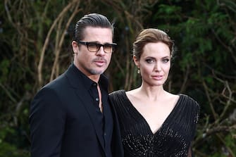 LONDON, UNITED KINGDOM - MAY 08: Brad Pitt and Angelina Jolie attend a private reception as costumes and props from Disney's "Maleficent" are exhibited in support of Great Ormond Street Hospital at Kensington Palace on May 8, 2014 in London, England. (Photo by Fred Duval/FilmMagic)