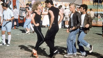 Olivia Newton-John and John Travolta on the set of Grease, directed by Randal Kleiser, 1978. (Photo by Paramount Pictures/Sunset Boulevard/Corbis via Getty Images)