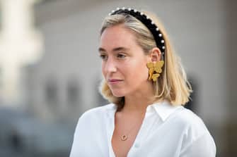 BERLIN, GERMANY - JULY 02: Sonia Lyson is seen wearing white blouse with feathers Zara, earring and hair loop Jeniffer Behr during Mercedes Benz Fashion Week Berlin on July 02, 2019 in Berlin, Germany. (Photo by Christian Vierig/Getty Images)