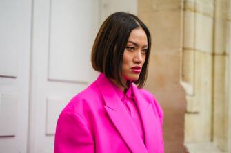 PARIS, FRANCE - OCTOBER 02: Tiffany Hsu wears a neon pink shirt, a neon pink oversized blazer jacket, outside Valentino, during Paris Fashion Week - Womenswear Spring/Summer 2023, on October 02, 2022 in Paris, France. (Photo by Edward Berthelot/Getty Images)