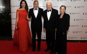 epa10347296 (L-R) Amal Clooney, George Clooney, Nick Clooney and Nina Clooney arrive for the formal Artist's Dinner honoring the recipients of the 45th Annual Kennedy Center Honors at the Department of State in Washington, DC, USA, 03 December 2022. The 2022 honorees are: actor and filmmaker George Clooney, contemporary Christian and pop singer-songwriter Amy Grant, legendary singer of soul, Gospel, R&B, and pop Gladys Knight, Cuban-born American composer, conductor, and educator Tania Leon, and iconic Irish rock band U2, comprised of band members Bono, The Edge, Adam Clayton, and Larry Mullen Jr.  EPA/Ron Sachs / POOL
