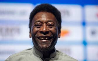 (FILES) In this file photo taken on January 15, 2018 legendary Brazilian footballer Pele, smiles during the opening event of the 2018 Carioca Football Championship at Cidade das Artes in Rio de Janeiro, Brazil. - Brazilian football icon Pele, widely regarded as the greatest player of all time and a three-time World Cup winner who masterminded the 'beautiful game', died on December 29, 2022 at the age of 82, after battling kidney problems and colon cancer. (Photo by MAURO PIMENTEL / AFP)