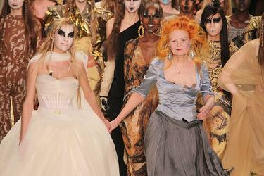 PARIS, FRANCE - MARCH 04: AVivienne Westwood (R) and a model walk the runway during the Vivienne Westwood Ready to Wear Autumn/Winter 2011/2012 show during Paris Fashion Week at Pavillon Concorde on March 4, 2011 in Paris, France. (Photo by Antonio de Moraes Barros Filho/WireImage)
