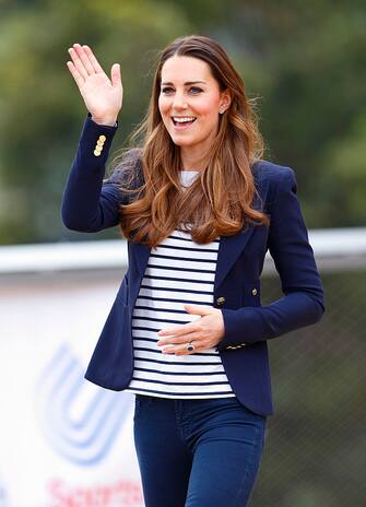 LONDON, UNITED KINGDOM - OCTOBER 18: (EMBARGOED FOR PUBLICATION IN UK NEWSPAPERS UNTIL 48 HOURS AFTER CREATE DATE AND TIME) Catherine, Duchess of Cambridge waves as she leaves the Copper Box Arena in the Queen Elizabeth Olympic Park after attending a SportsAid Athlete Workshop on October 18, 2013 in London, England. (Photo by Max Mumby/Indigo/Getty Images)