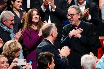 LYON, FRANCE - OCTOBER 21: (LR) Claude Lelouch, Monica Bellucci and Tim Burton attend the Lumiere Award ceremony during the 14th Film Festival Lumiere on October 21, 2022 in Lyon, France.  (Photo by Sylvain Lefevre/Getty Images)