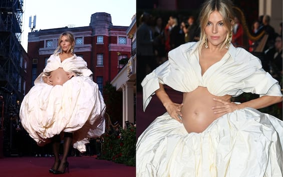 Sienna Miller is pregnant, pregnancy confirmed in photos from Vogue event in London