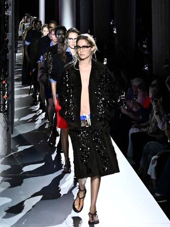US model Gigi Hadid walks the runway with models to present creations by Miu Miu during the Paris Fashion Week Womenswear Spring/Summer 2024 in Paris on October 3, 2023. (Photo by JULIEN DE ROSA / AFP) (Photo by JULIEN DE ROSA/AFP via Getty Images)