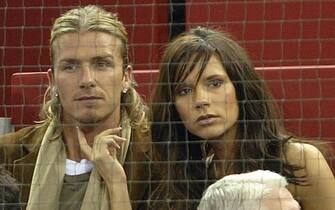 MADRID, SPAIN:  Real Madrid's British player David Beckham and his wife Victoria watch the Masters Series match beetwen Spaniard Juan Carlos Ferrero and South African Wayne Ferreira in Madrid, 15 October 2003.  AFP PHOTO    Pierre-Philippe MARCOU  (Photo credit should read PIERRE-PHILIPPE MARCOU/AFP via Getty Images)