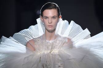 TOPSHOT - A model presents a creation by Giambattista Valli during the 2019 Spring-Summer Haute Couture collection fashion show in Paris, on January 21, 2019. (Photo by Anne-Christine POUJOULAT / AFP)        (Photo credit should read ANNE-CHRISTINE POUJOULAT/AFP via Getty Images)