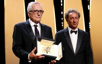 epa09350841 Italian director Marco Bellocchio (L) receives the Honorary Palme d'or during the Closing Awards Ceremony of the 74th annual Cannes Film Festival, in Cannes, France, 17 July 2021. The Golden Palm winning movie will be screened after the
closing ceremony.  EPA/SEBASTIEN NOGIER