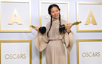 epaselect USA ACADEMY AWARDS 2021 epaselect epa09161077 Chloe Zhao, winner of the awards for best picture and director for 'Nomadland,' poses in the press room at the 93rd annual Academy Awards ceremony at Union Station in Los Angeles, California, USA, 25 April 2021. The Oscars are presented for outstanding individual or collective efforts in filmmaking in 24 categories. The Oscars happen two months later than originally planned, due to the impact of the coronavirus COVID-19 pandemic on cinema. EPA/Chris Pizzello / POOL *** Local Caption *** 55864152