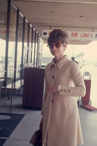 Audrey Hepburn wearing a beige wool coat and sunglasses at the airport; April 1st 1968 ; New York. (Photo by Art Zelin/Getty Images)