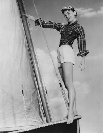 Actress Audrey Hepburn (1929 - 1993) poses barefoot on a sailing boat on the set of the film 'Sabrina Fair', 1954. (Photo by Archive Photos/Getty Images)