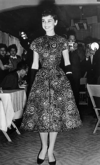 Screen star Audrey Hepburn (1929 - 1993) models a new collection at an Amsterdam fashion show, 2nd November 1954. (Photo by Keystone/ulton Archive/Getty Images)
