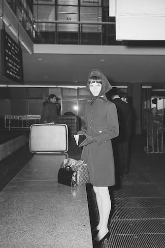 (Original Caption) 3/5/1968-Rome, Italy-Smartly attired, Audrey Hepburn goes through customs at Rome's Airport. The actress is reportedly taking a rest in the Eternal City before contacting Italian producers.