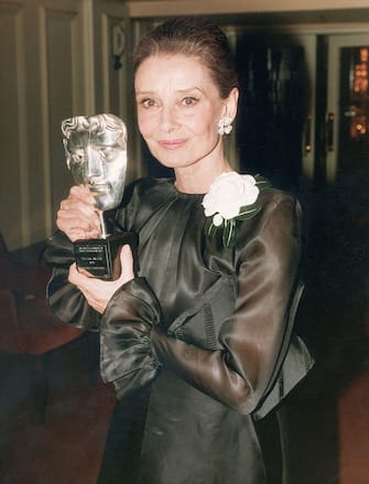 Film star Audrey Hepburn (1929 - 1993) with the Special Award she received from the British Academy of Film and Television Arts, 1992. (Photo by Dave Hogan/Hulton Archive/Getty Images)