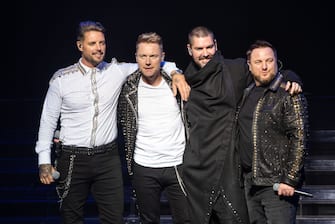 LONDON, ENGLAND - OCTOBER 21:  (EDITORIAL USE ONLY) (L-R) Keith Duffy, Ronan Keating, Shane Lynch and Mikey Graham of Boyzone perform on stage during "The Final Five tour" at the London Palladium on October 21, 2019 in London, England.  (Photo by Joseph Okpako/WireImage)