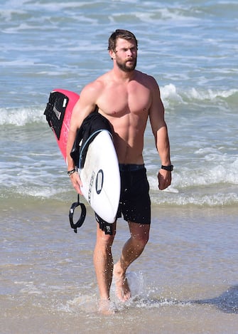 BYRON BAY, NSW - APRIL 28:  Chris Hemsworth is seen surfing and relaxing at the beach on April 28, 2016 in Byron Bay, Australia.  (Photo by Matrix/GC Images)