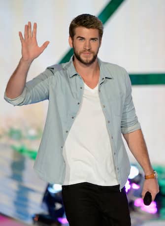 UNIVERSAL CITY, CA - AUGUST 11:  Actor Liam Hemsworth appears onstage at the 2013 Teen Choice Awards at Gibson Amphitheatre on August 11, 2013 in Universal City, California.  (Photo by Kevin Mazur/Fox/WireImage)