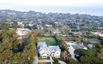 BGUK_2064568 - Los Angeles, CA  - Coldplay's Chris Martin and girlfriend Dakota Johnson reportedly buy $12.5 million Malibu, CA love nest together. The couple, who have been together for three years since October 2017, snapped up a white modern Cape Cod style estate complete with a swimming pool, hot tub and home theater for $12.5million in October 2020, according to a report in the New York Post. The swanky Malibu home was first placed on the market in July 2020 for $14million.  There are a total of six bedrooms and nine bathrooms in the home that is 5,338 sq ft over two levels.  There is also a two-story guest house with a game room, living room, kitchen and bedroom for any guests of the couple. The outdoor area is large and plush with a long swimming pool, attached hot tub, a lounge area as well as a dining area with fireplace, and a full outdoor barbecue section that includes a bar. The property is gated and has plenty of security for the Brit singer and the  50 Shades of Grey actress as mature trees also line the property for added privacy. The living room has a fireplace and stunning views of the Pacific Ocean and the surrounding mountains while the kitchen is huge with a marble top island. The master bathroom offers two counters and a stand-alone white tub in front of a window.

*BACKGRID DOES NOT CLAIM ANY COPYRIGHT OR LICENSE IN THE ATTACHED MATERIAL. ANY DOWNLOADING FEES CHARGED BY BACKGRID ARE FOR BACKGRID'S SERVICES ONLY, AND DO NOT, NOR ARE THEY INTENDED TO, CONVEY TO THE USER ANY COPYRIGHT OR LICENSE IN THE MATERIAL. BY PUBLISHING THIS MATERIAL , THE USER EXPRESSLY AGREES TO INDEMNIFY AND TO HOLD BACKGRID HARMLESS FROM ANY CLAIMS, DEMANDS, OR CAUSES OF ACTION ARISING OUT OF OR CONNECTED IN ANY WAY WITH USER'S PUBLICATION OF THE MATERIAL*

Pictured: GV, General View

BACKGRID UK 27 JANUARY 2021 

BYLINE MUST READ: Realtor.com / BACKGRID

UK: +44 208 344 2007 / uksales@backgrid.com

USA: +1 310 798 9111 / usasales@backgrid.com

*UK Clients - Pictures Con