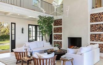 BGUK_2064568 - Los Angeles, CA  - Coldplay's Chris Martin and girlfriend Dakota Johnson reportedly buy $12.5 million Malibu, CA love nest together. The couple, who have been together for three years since October 2017, snapped up a white modern Cape Cod style estate complete with a swimming pool, hot tub and home theater for $12.5million in October 2020, according to a report in the New York Post. The swanky Malibu home was first placed on the market in July 2020 for $14million.  There are a total of six bedrooms and nine bathrooms in the home that is 5,338 sq ft over two levels.  There is also a two-story guest house with a game room, living room, kitchen and bedroom for any guests of the couple. The outdoor area is large and plush with a long swimming pool, attached hot tub, a lounge area as well as a dining area with fireplace, and a full outdoor barbecue section that includes a bar. The property is gated and has plenty of security for the Brit singer and the  50 Shades of Grey actress as mature trees also line the property for added privacy. The living room has a fireplace and stunning views of the Pacific Ocean and the surrounding mountains while the kitchen is huge with a marble top island. The master bathroom offers two counters and a stand-alone white tub in front of a window.*BACKGRID DOES NOT CLAIM ANY COPYRIGHT OR LICENSE IN THE ATTACHED MATERIAL. ANY DOWNLOADING FEES CHARGED BY BACKGRID ARE FOR BACKGRID'S SERVICES ONLY, AND DO NOT, NOR ARE THEY INTENDED TO, CONVEY TO THE USER ANY COPYRIGHT OR LICENSE IN THE MATERIAL. BY PUBLISHING THIS MATERIAL , THE USER EXPRESSLY AGREES TO INDEMNIFY AND TO HOLD BACKGRID HARMLESS FROM ANY CLAIMS, DEMANDS, OR CAUSES OF ACTION ARISING OUT OF OR CONNECTED IN ANY WAY WITH USER'S PUBLICATION OF THE MATERIAL*Pictured: GV, General ViewBACKGRID UK 27 JANUARY 2021 BYLINE MUST READ: Realtor.com / BACKGRIDUK: +44 208 344 2007 / uksales@backgrid.comUSA: +1 310 798 9111 / usasales@backgrid.com*UK Clients - Pictures Con