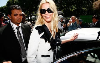PARIS - JULY 01:  Claudia Schiffer leaves the Chanel '09 Spring Summer Haute Couture fashion show at the Grand Palais, on July 1, 2008 in Paris, France.  (Photo by Julien Hekimian/WireImage) 