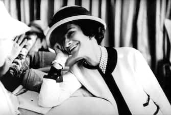 Posi: fashion designer Coco Chanel (1883-1971), c.  early 50's (Photo by Apic / Getty Images)