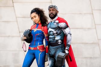 NEW YORK, NEW YORK - OCTOBER 31: People dressed as Thor and Captain Marvel pose for a photo outside the Brooklyn Museum on October 31, 2020 in New York City. Many Halloween events have been canceled or adjusted with additional safety measures due to the ongoing coronavirus (COVID-19) pandemic. (Photo by Noam Galai/Getty Images)