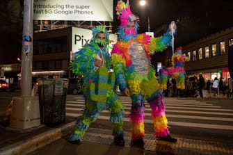 NEW YORK, NEW YORK - OCTOBER 31: People dressed as piÃ±atas pose in the West Village on October 31, 2020 in New York City. Many Halloween events have been canceled or adjusted with additional safety measures due to the ongoing coronavirus (COVID-19) pandemic. (Photo by Alexi Rosenfeld/Getty Images)